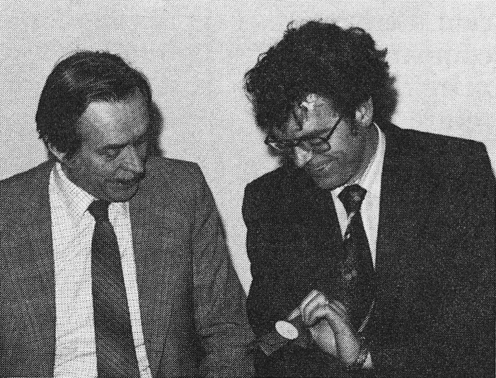 1980 Keith Airey and Dennis Watson took part in a Society of Dairy Technology Far East visit. Here shown with a milk bottle cap and wrapper from China. (Express News April)