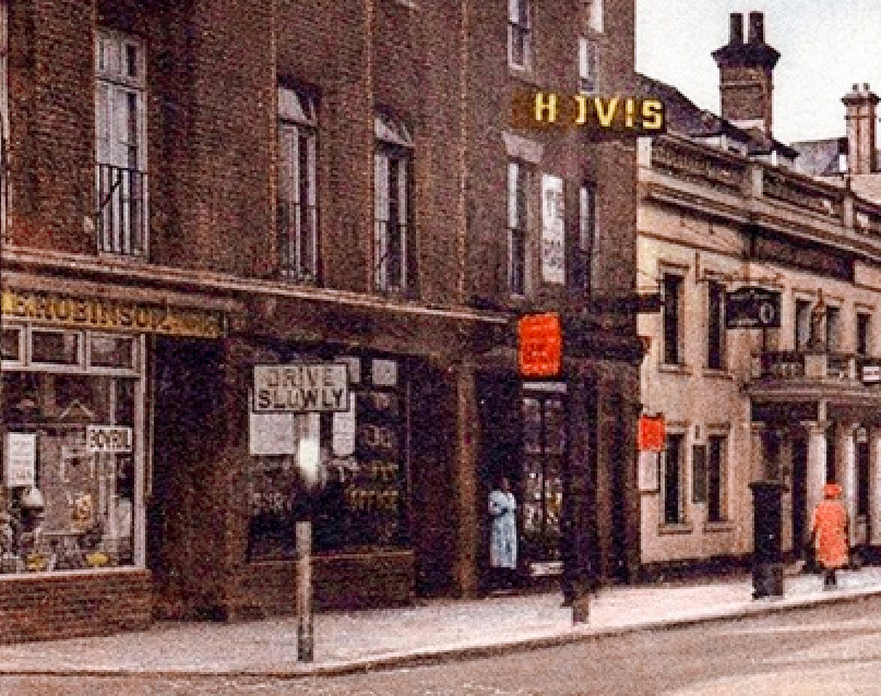 1912 postcard, shows ‘H.E. Robinson’ on the left with the White Hart on the right. H.E. Robinson Dairy, Mitcham, Surrey (Courtesy Mitcham History)