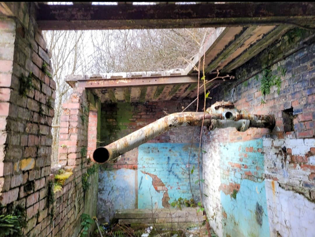 Sanquhar creamery waste outlet pumphouse, into the River Nith. Doug Stewart-McMillan comments "I remember this from my childhood in Sanquhar, especially when the creamery was working. It used to have a waste water outlet pipe into the Nith which used to discharge warm water and it was fantastic when we used to go swimming in that bit of the river. Happy days." (Courtesy Sanquhar Lass)