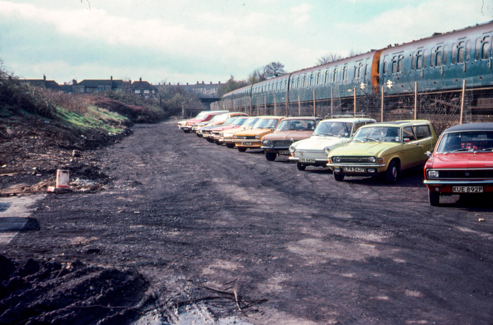 1979 old rail siding after track removal. Used temporarily as a car park before conversion to lorry park