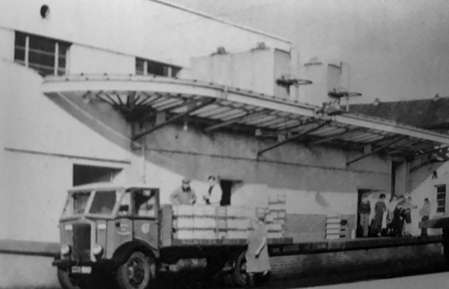 Kilmaurs Creamery, loading dock on the railway side.  Robert McKillen comments "Mr Lockhart was the manager and I know all the other guys... they were the good days-we made our own fun. Steven Poggi adds "My Grandpa Lockhart was MD there, and my dad worked in the labs, before it was taken over by Express Dairy. Our neighbour, Arthur Otto worked there too." (Courtesy Steven Poggi, Kilmaurs And Stewarton Memories FB Group)