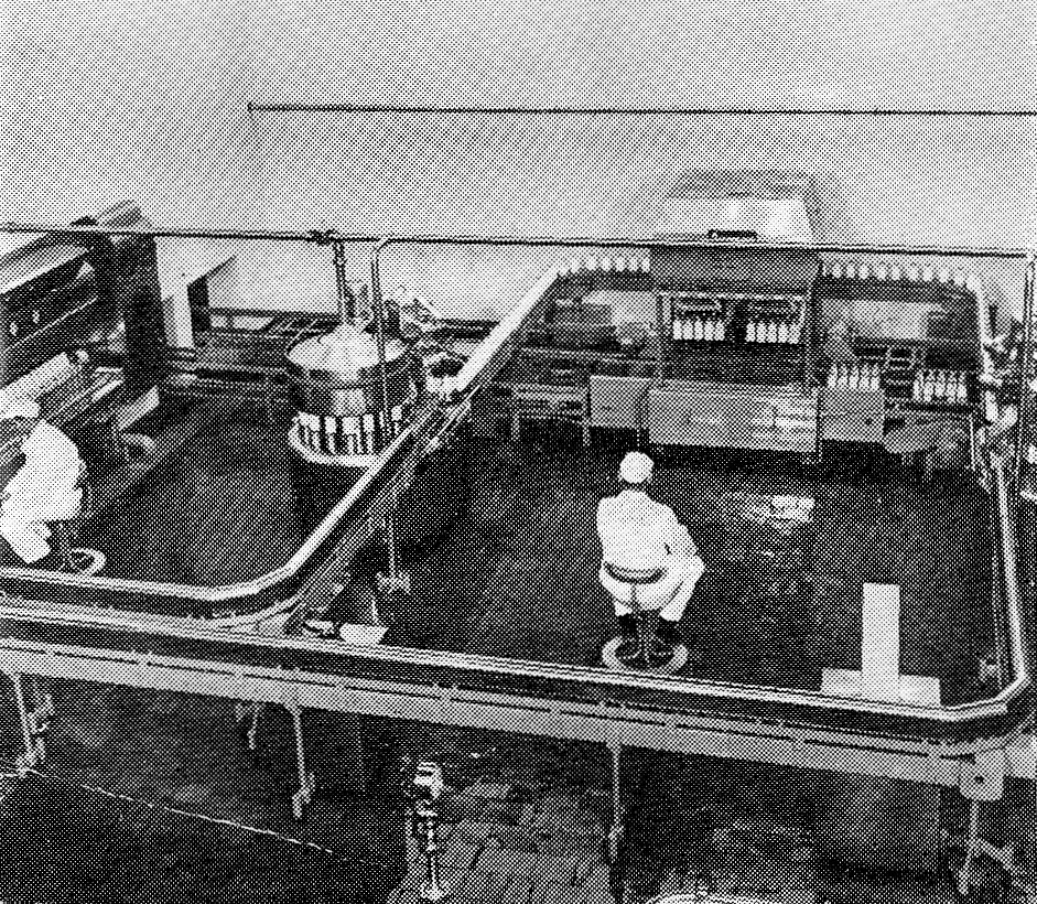 1958 Wakefield Dairy opens. Scrutiniser Mr Frank Lord and Dairyhand Mr Tom Bradley hold a watching brief in adjustable chairs. (Express News December)