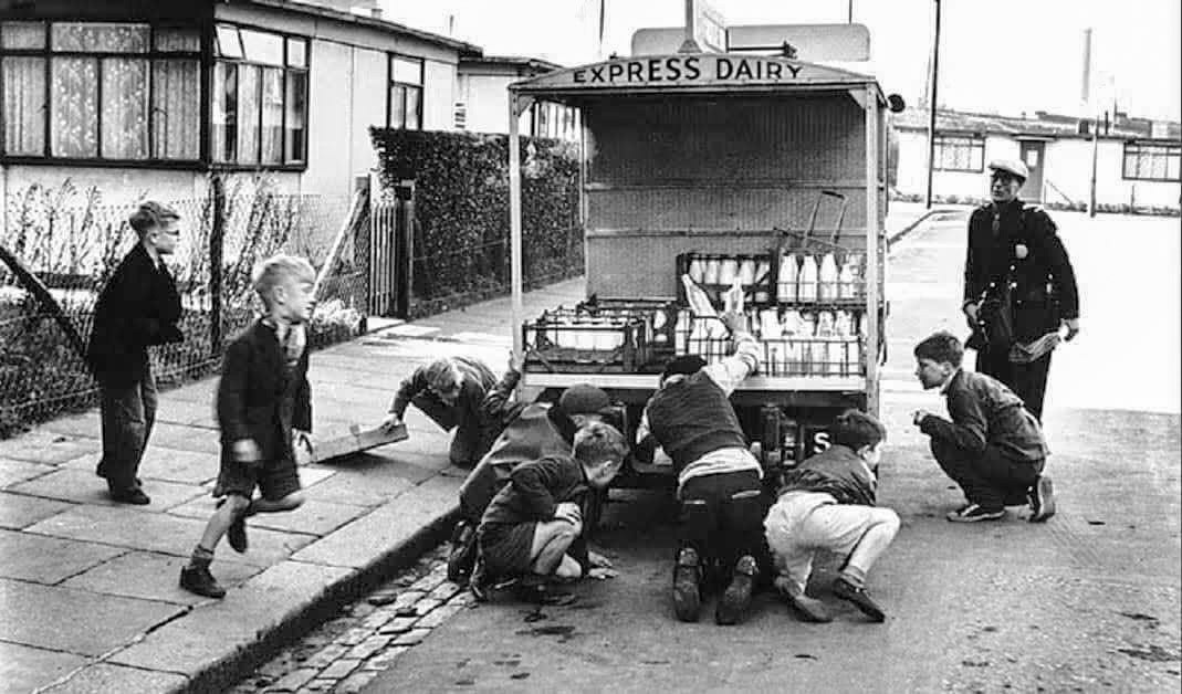 1950's Express Dairy float 'ambushed' by a gang of young boys in Orville Road,  just off Battersea High Street; with prefabs in the background. (Courtesy William D.T. Davis)