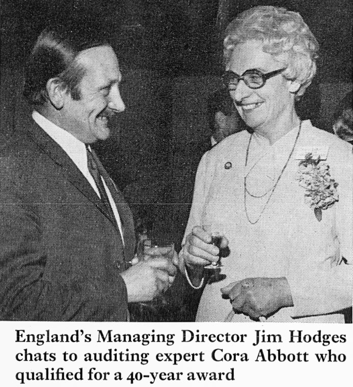 1973 Jim Hodges talks to auditor Cora Abbott, who receives a 40 year award. (Express News Spring)