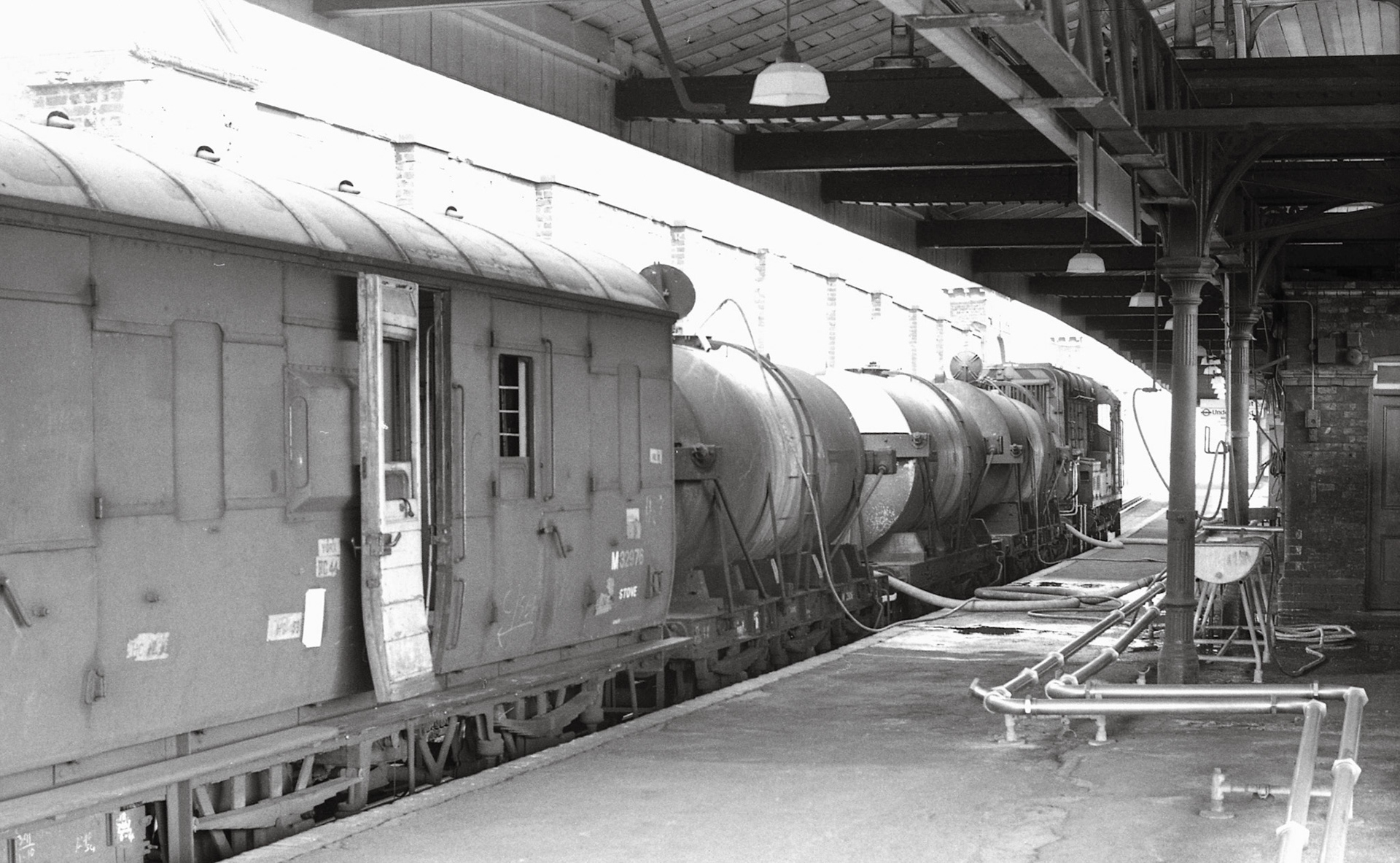 1975 Milk from Torrington being discharged at Vauxhall station on 2 August, the train being shunted by 09:05. Courtesy Kevin Lane, Flickr