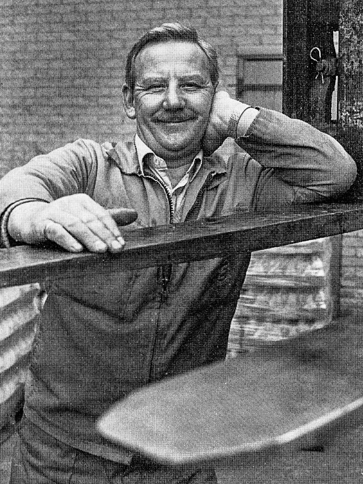 1984 Les Hays, chargehand in the blow moulding area, with a handful of granules — 18g to be precise—which is all that is required to make the bottle he is holding in the other hand. Les, who has been with Express Dairy for eight years, works a 12-hour day shift, from 8 am to 8 pm. The blow moulders work around the clock; the raw plastic being fed into them from a 40 tonne silo. They gobble up two tonnes of granules each day, and produce 120,000 bottles. The new blow moulder will greatly increase that output. The bottles, once made, are blown by compressed air along tubes to the bottle fillers. Most of his colleagues wear ear protectors. Les's solution to the noise problem, caused by the grinders, is cotton wool, because he finds it much more comfortable. Away from his job, Les — a married man with a son, 19, and daughter, 22 — 1ikes to visit places of interest and take photographs. His face may look familiar to wrestling fans, he used to wrestle as an amateur and a professional in Bradford. He was a lightweight in those days, weighing in at nine stone 12 ounces. (Express News Spring)