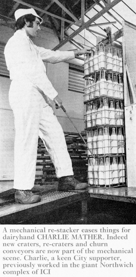 1971 Wythenshawe-Charlie Mather stacking crates of sterilised milk. (Express News Xmas)