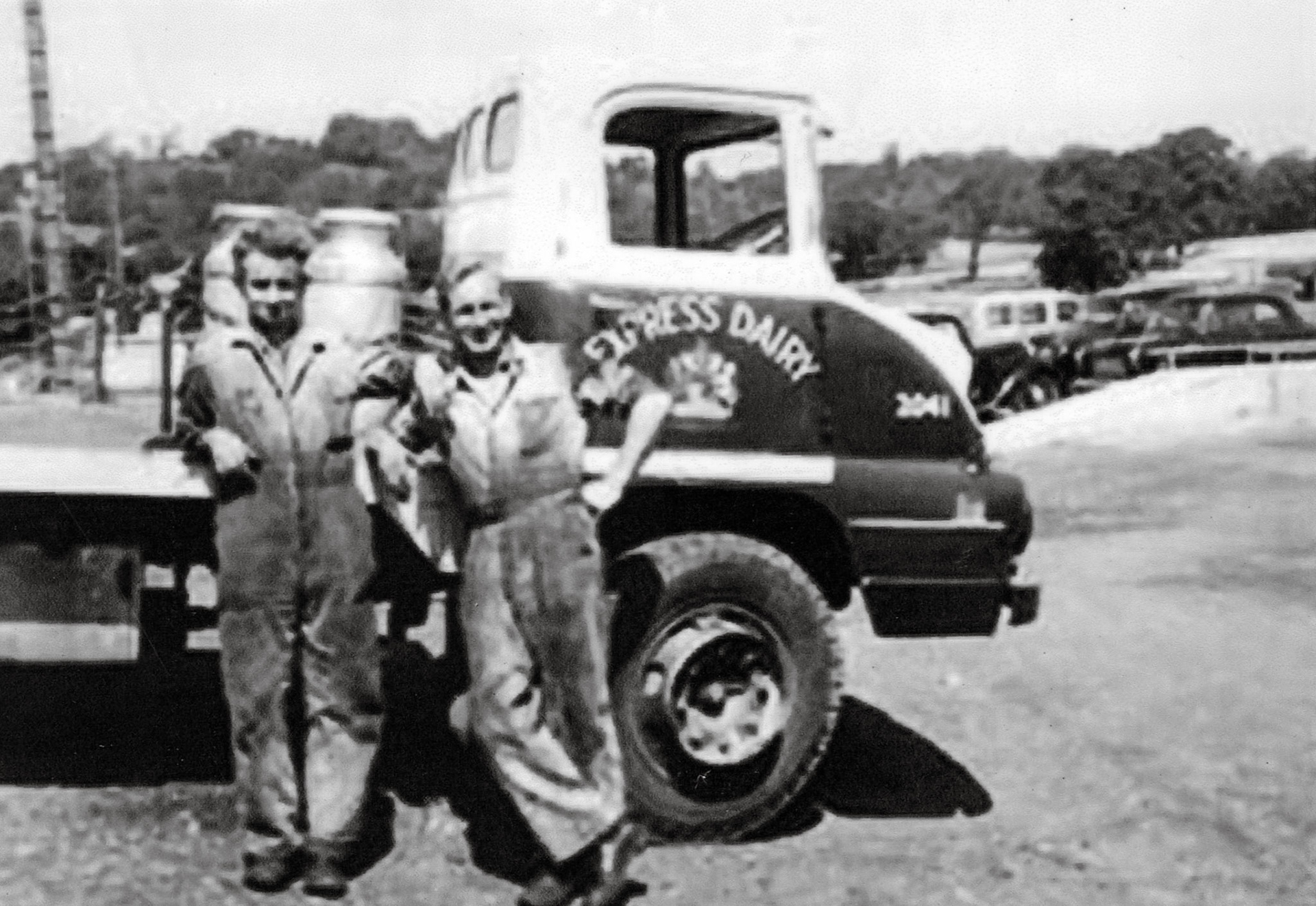 James Ayres comments "The vehicle in the background is an S type Bedford tractor unit made by Vauxhall (General Motors) throughout the 1950s. Most often seen in a rigid chassis it was offered with a choice of petrol or diesel engines." Sue West comments "Is that Colin White?, I believe they are mechanics (hence dirty overalls!)" (Courtesy Allhallows Museum, Honiton)