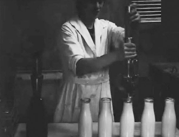 Milk Production Story (1920-1930) - from the cow to the baby's bottle. British Pathé. Within a few minutes of the milking, the bottles are filled and sealed.