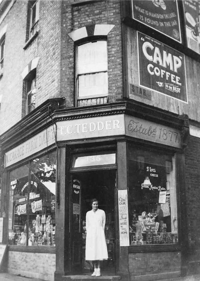 1938 One of the staff outside the Vicarage Farm Dairy shop in Kew Road, Richmond, 1938. (Courtesy Megan Hayes, Peoples Collection Wales)