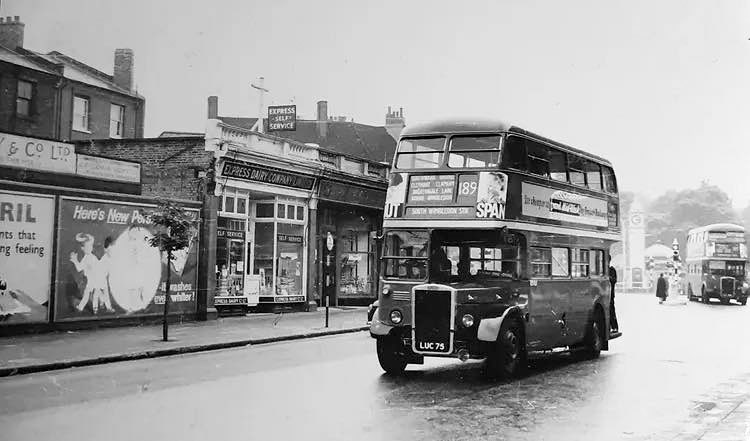 1950s Clapham High Street, Steven comments "...Lovely Express Dairy shopfront and some great advertising for Persil and Bovril. You can just make out the entrance to Clapham Common station". (Courtesy Steven Erny Hern, Old milkmen will never die FB Group)
