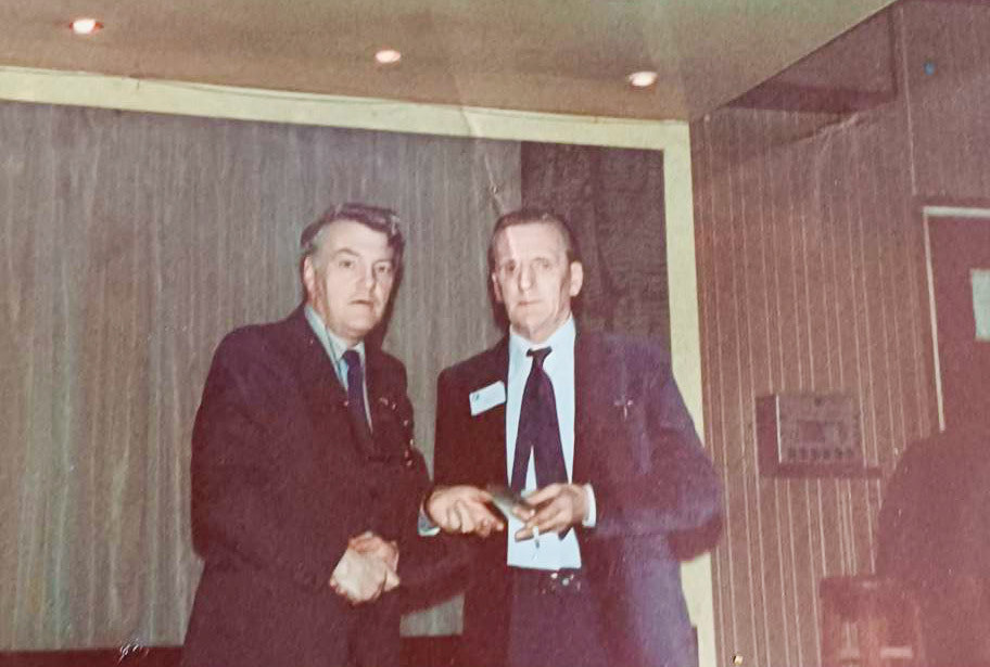 1970s, Ken Hunt making a presentation to Cyril Yates., picture from his son, Kevin Yates; his dad passed in 1978. Chris Austen comments "Ken Hunt worked for Hammett’s Dairies which was acquired by Express in 1971; he became Regional Director and then performed the same function in the Northern Region when he was promoted in 1976."