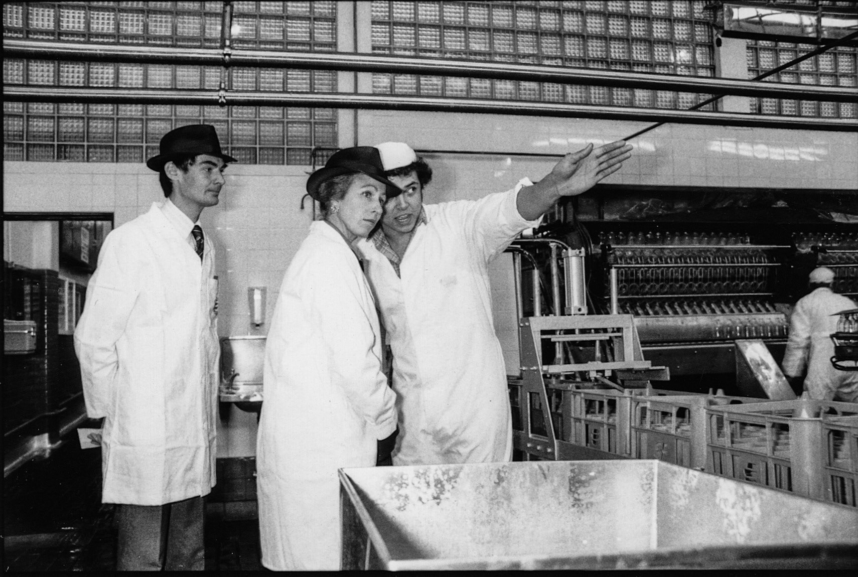 Albi Charles showing Princess Anne the filling room