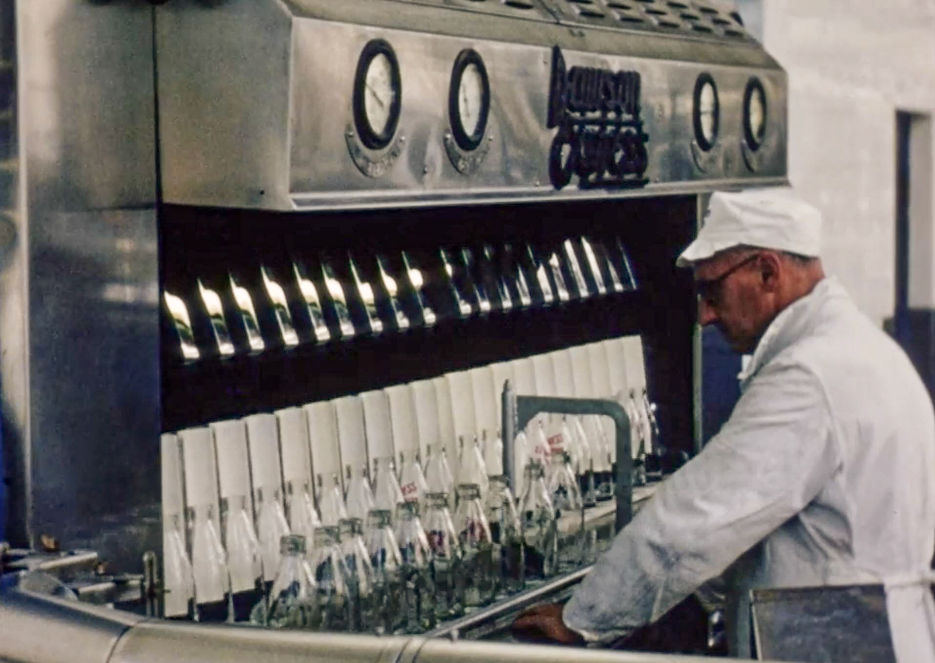 1954 South Morden Processing-Scrutinising bottles before filling. (Stills from Express Dairy Film)