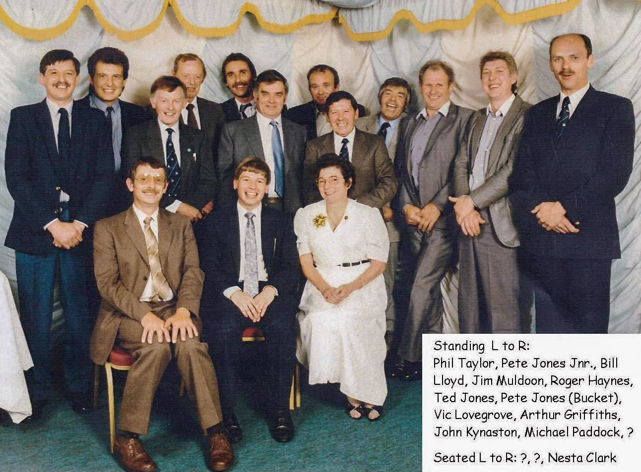 1993 Long service awards night at Express Ruyton, with Phil Taylor, Pete Jones Jnr, Bill Lloyd, Jim Muldoon, Roger Haynes, Ted Jones, Pete Jones, Vic Lovegrove, Arthur Griffiths, John Kynaston, Michael Paddock and Nesta Clark seated. Maurice Walton and Dai Williams identify Mark Bevan, middle, seated. Standing, right - John Ogden. (Courtesy Margaret Lycett, Ruyton Revisited FB Group)
