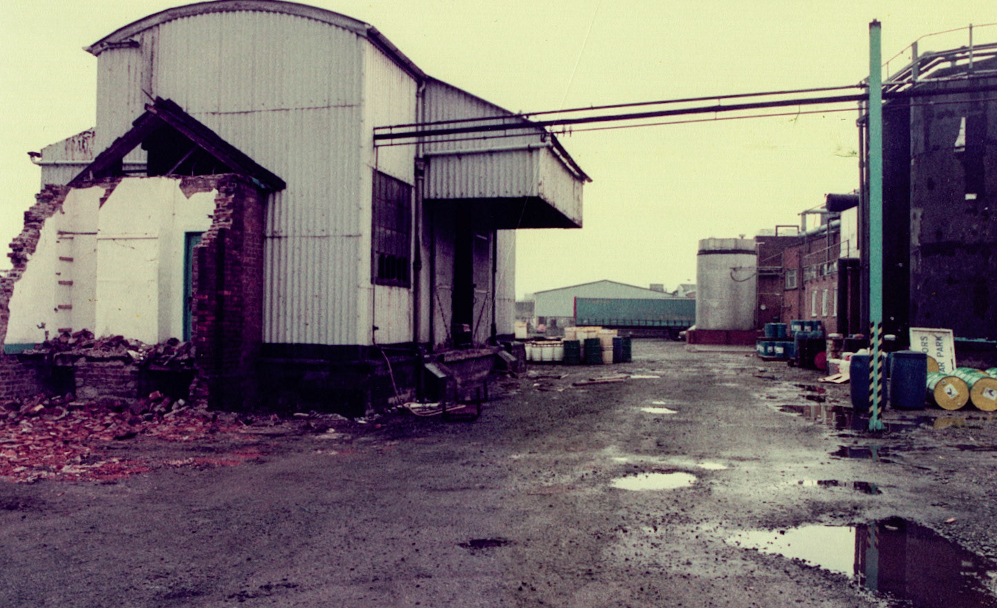 Peter Davies comments "1982 old railway loading and unloading building, with office used as detergent store being knocked down to make way for new milk reception" (Courtesy Joe Lyons)