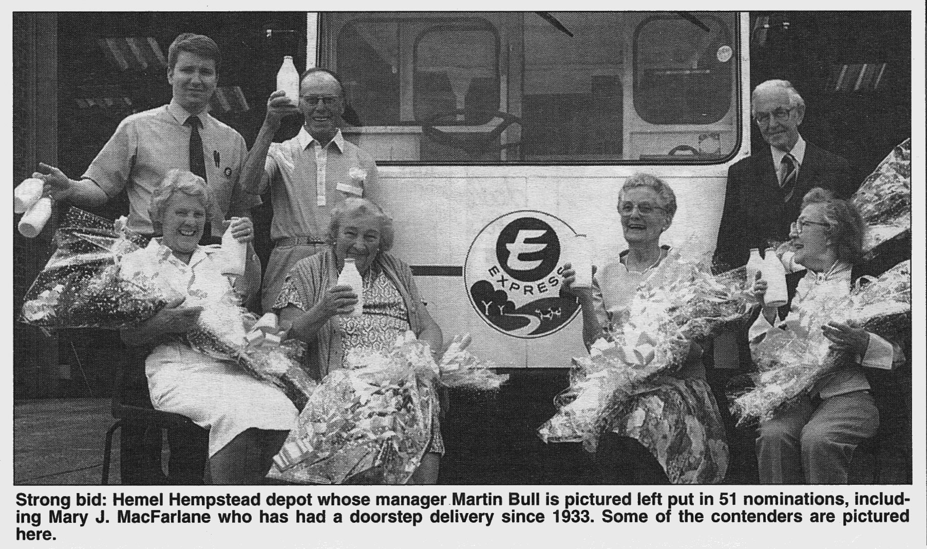 1995 Hemel Hempstead manager Martin Bull presents flowers to elderly customers. (Courtesy Michael Aldread)
