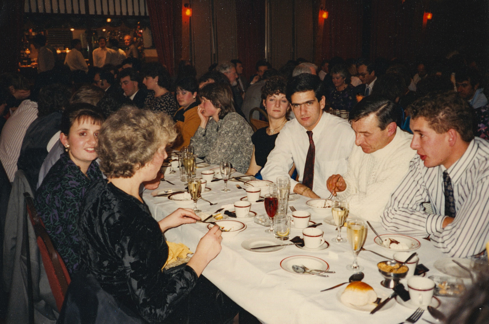 1990 Honiton 'Xmas' celebration. Soo comments "Because we were always so busy with Christmas cream and butter, we always had our 'Xmas Do' in January, here at the Honiton Motel, who kept the decorations up. I am on the left, looking at the camera, on my right is Jane (a temp who helped with BS5750 document preparation). Opposite me is Anne Seward, Personnel Officer. Photo taken by Paula Boult, nee Stanton" (Courtesy Soo Rose-Cook)