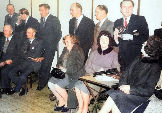 1953 "Doreen Ball, Linda Swain, Charliz?, ? Hills, Bill Childs, Dave Cullis, Dick Bells, Louise Pidwell". Phil Ruff comments "I remember Linda ladling out the milk allowance." Lorraine Fletcher says "Gosh there’s Linda, she lived up the road from us and used to baby sit." Debbie Llewellyn adds "I remember the milk having to be boiled before we could use it." Debbie Llewellyn The milk jug :)) (Colourised version courtesy of Sarah Chadwick Jones)