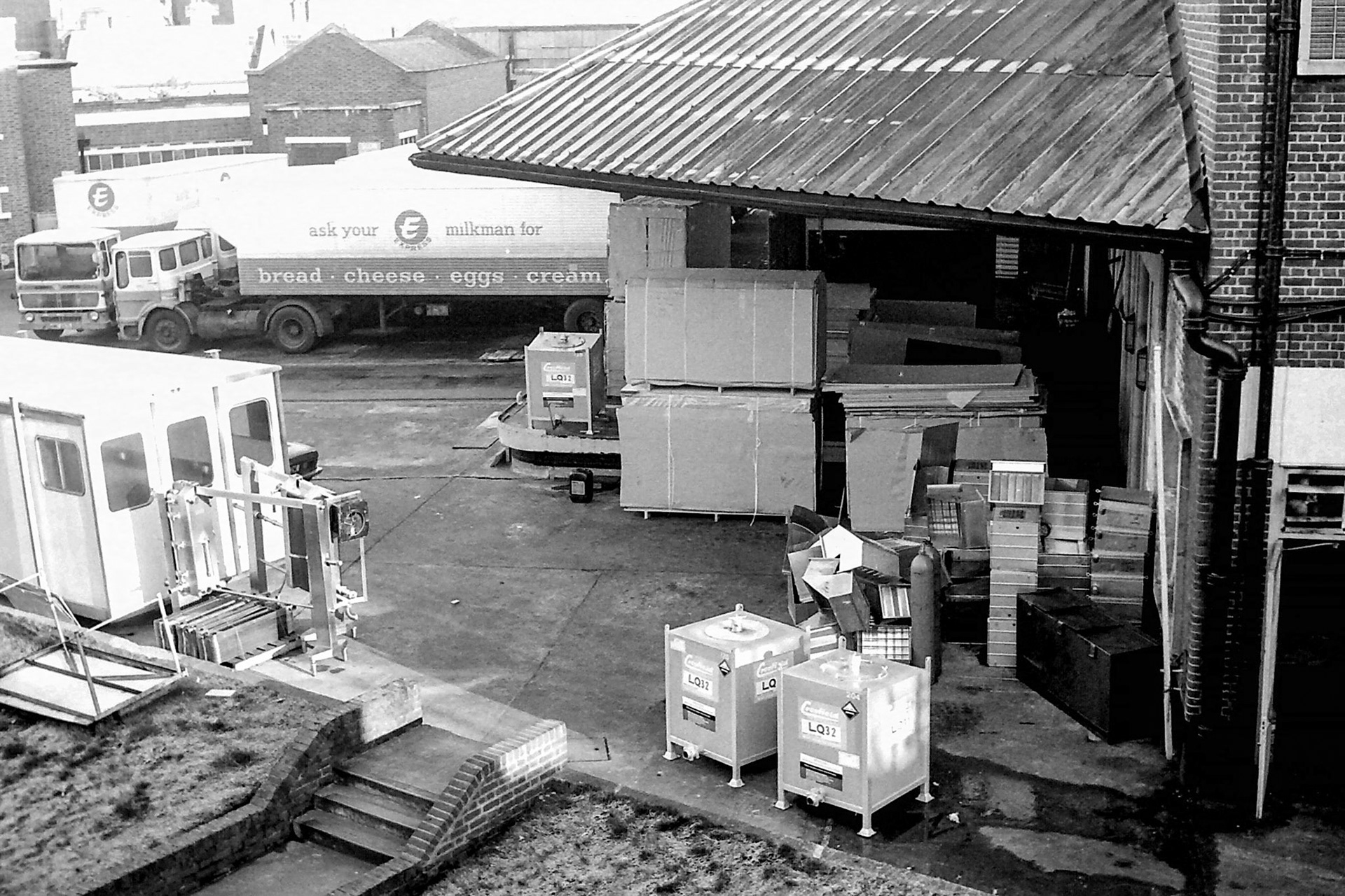 1979 Busy scene in the front yard at South Morden, with materials and contractor's hut temporarily located before the new cold store and loading bays were constructed. (Photographer Sam Jones)
