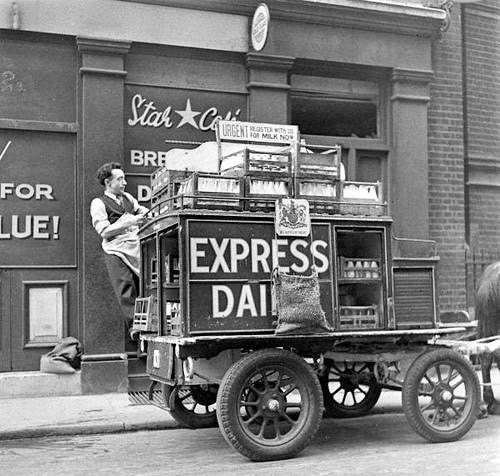 1930's? Horse drawn cart. Possibly around the outbreak of WWII as poster reads "Urgent register with us for milk No.". (Courtesy Michael Aldread)