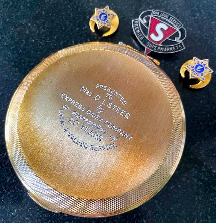 1960s Powder compact presented to Mrs D.I. Steer for 20 years service, Premier Supermarkets long service badge, 'E Star Driver' badges (Courtesy Leslie Croxford)