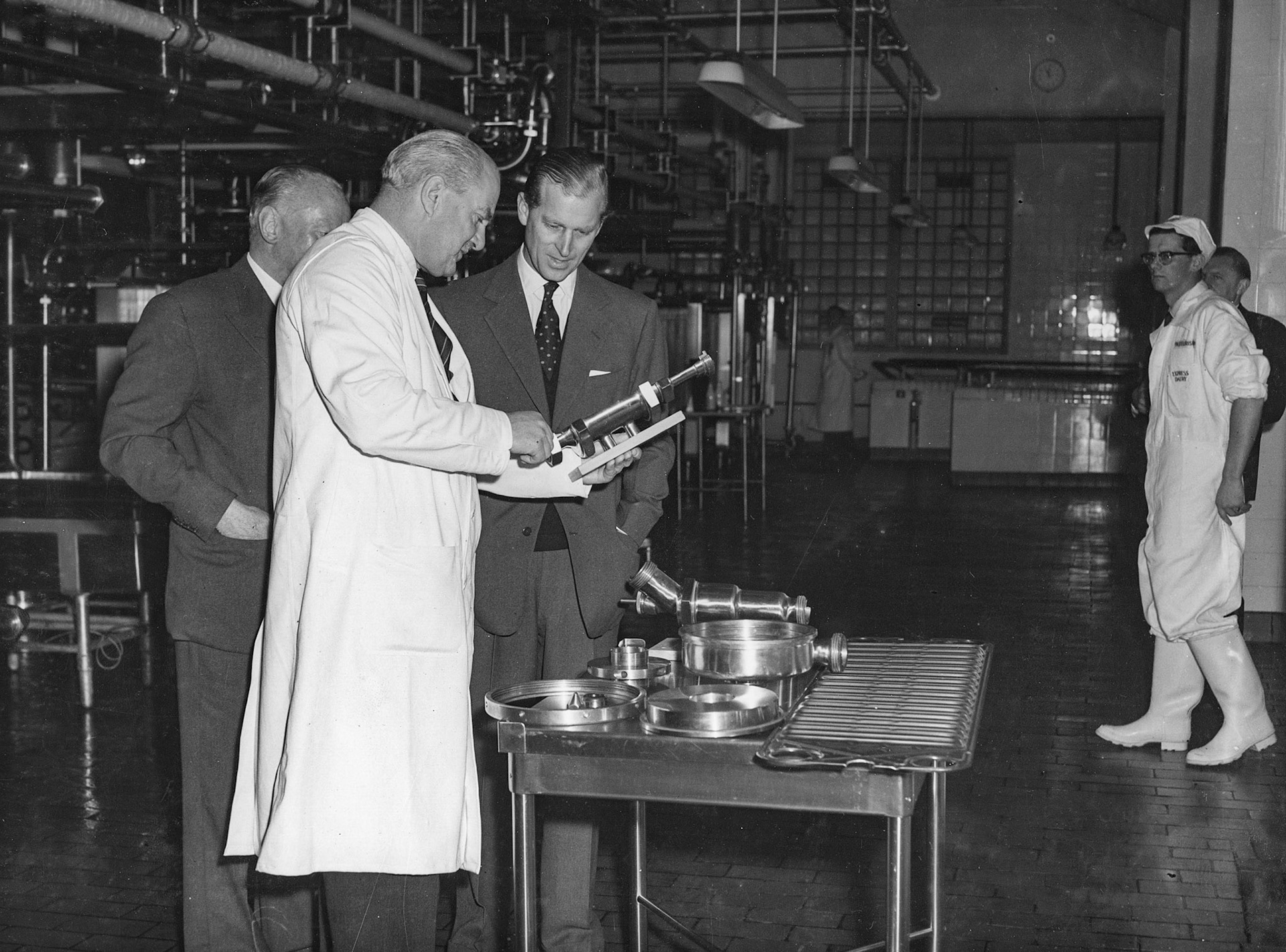 1957 South Morden-Duke of Edinburgh's visit on November 12-Mr T.D, Potter Processing Director explains the operation of an automatic valve to the Duke, with Walter Nell looking on (Courtesy Paul Luke)