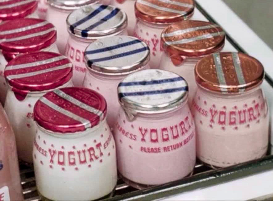 1960's Express yogurt in glass jars. Chris Austen comments "These yogurts were produced at "Yogfruit", a facility in Colindale. They were all set curd, incubated in warm water baths, and you could enjoy plain, banana, strawberry and raspberry - a far cry from the multitude of flavours and types which are available today!!" (Courtesy Paul Smith)