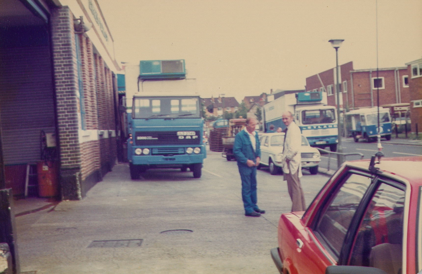 1980s Bromley Processing frontage and nearby roads. Paul Batchelor recognises George Cavell in the white coat, and in the blue Derek Colvin.  (Pictures by Reg Ball, on loan from Colin Bristow)