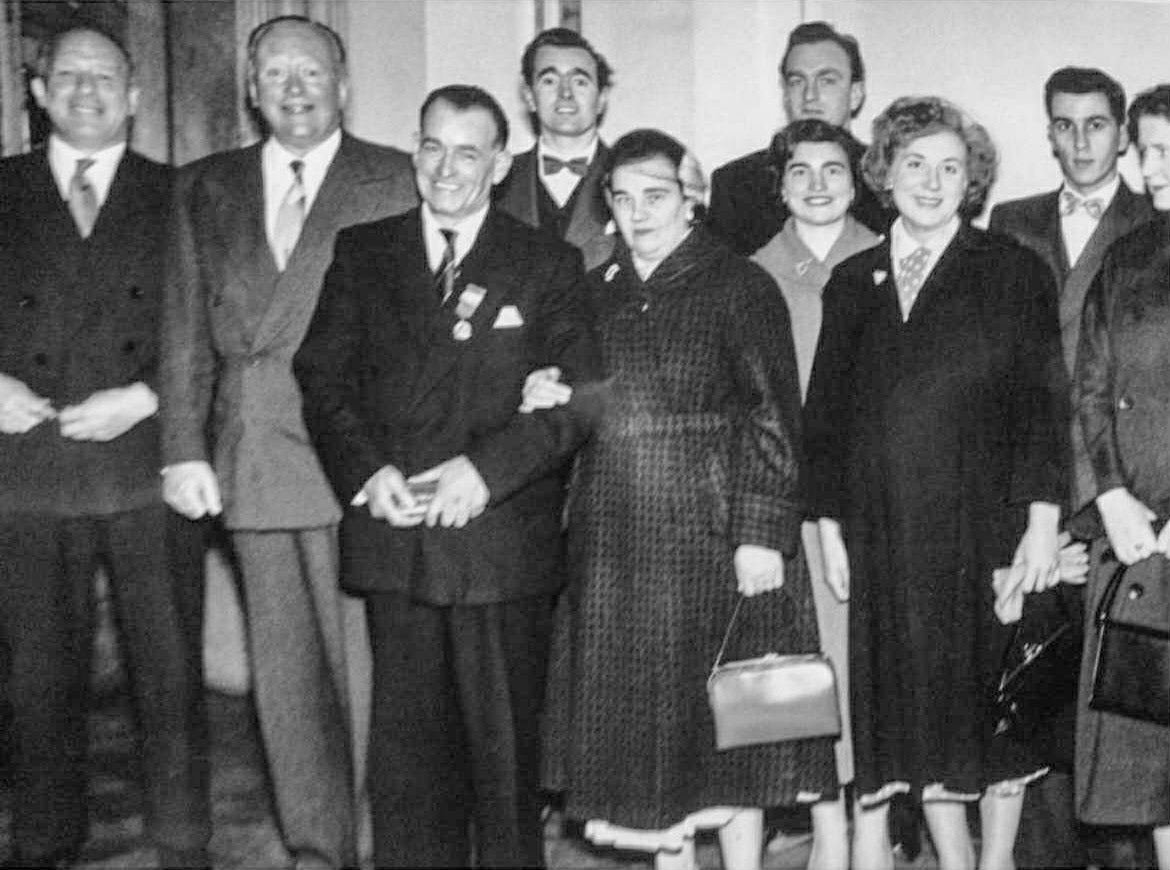 1955 Charles Denney at the presentation, with Walter Nell. Pauline comments "My grandad, my mum is the second lady from the left, Charles's only daughter of his seven children" (Courtesy Pauline Theobald)