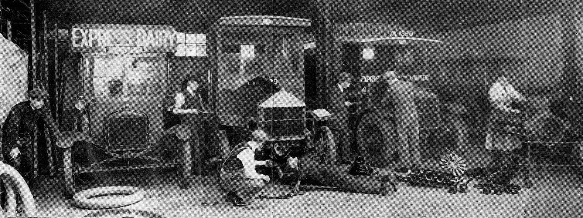 1890's Three iron monsters of the past, a Model T Ford, a Lacre and a Garford receive attention at Chalk Farm. (From Express News 1958-September)