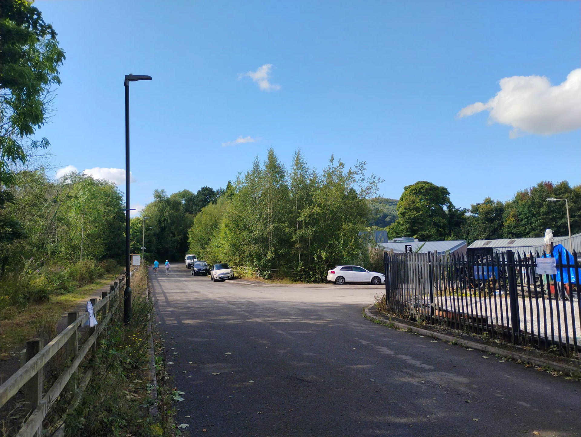 2024 Rowsley station site as it is today looking North. Dave Walker-Smith comments  "Taken from what would have been the middle of the old down line. The station building itself was just behind the parked white van. The new buildings to the right occupy the site of the old Express Dairy site. Interestingly, several Scots pines, beloved of the Midland as planted ornamental trees at their stations, still survive in the background." Tim Whelbourn adds "Do you remember the cooling pond at the Express Dairy- it used to fizz up… my grandad used to tell us it was lemonade 😁." Dave Walker-Smith replies "Big black cast iron tanks with sprinklers." (Courtesy Dave Walker-Smith)