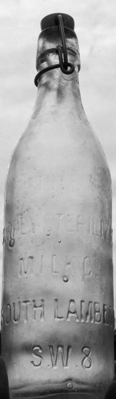 1920s sterilised pint milk bottle embossed with: "THE SURREY STERILIZED MILK CO, SOUTH LAMBETH,S.W.8. On the reverse side near the base: "THIS BOTTLE CONTAINS NOT LESS THAN NINE-TENTHS OF A PINT. William Davis comments "Originally it would have been sealed with a porcelain swing stopper attached by a wire bail. The Surrey Sterilized Milk Co. was based at Nine Elms and was acquired by Express Dairy in the early 1960s." (Courtesy William D.T. Davis)