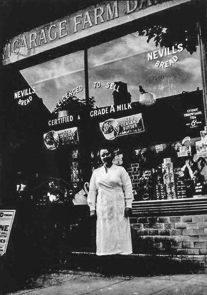 1938 Bet Davies, from Wales, one the staff at Vicarage Farm Dairy, Richmond, came from Cwmsychpant, Cardiganshire working as a maid for a family that moved from Cardiganshire to London to work in the milk industry. They owned this shop in Richmond, London.