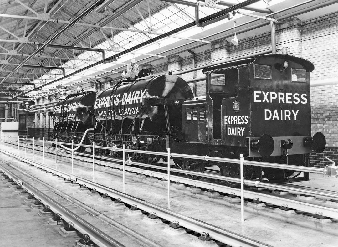1955 South Morden. Jimmy Reid posted this picture, and comments "This is how we got our name from the trains that delivered bulk milk to depots and plants across the country." Colin J Marsden also commented "When I was a young secondman at Waterloo, a regular turn was to go on the Morden Milk, taking a few GW 6-wheel tanks round in the morning and going to fetch them early afternoon after off-loading. Quite often the morning inbound train was worked through by Western men. Over the years I took a number of pictures at the milk terminal and one day one of the older staff came over with a black and white picture taken at the depot in 1955. He said 'you can have this, this is what it was like here in the 50s'. I carefully preserved it and today I've scanned it. I do not know the details of the loco, but he said it was taken the day it was delivered to the facility. (Courtesy Colin J Marsden and Jimmy Reid) Poor quality version also published in Express News July 1956