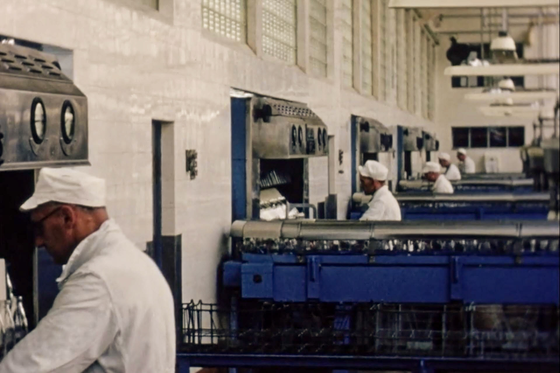 1954 South Morden Processing-Scrutinising bottles before filling, on five lines that were then operational. (Stills from Express Dairy Film)