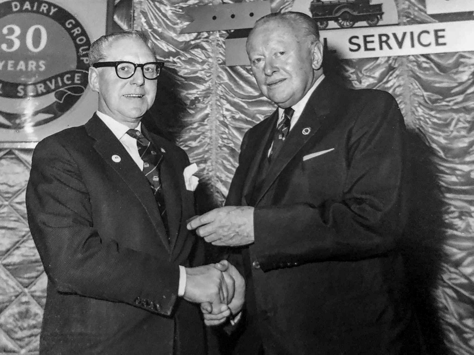 1960s Cricklewood and South Ruislip. Gina comments "My grandad George Sidney Turner. Walter Nell is presenting him with an award for 30 years service . I imagine this was the early 60s as my grandad died in 1968." (Courtesy Gina Jackson)