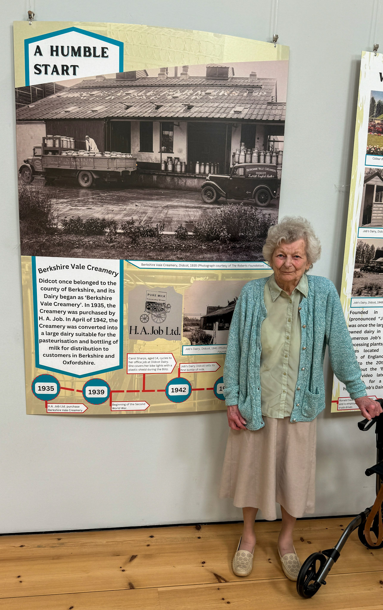 Coral Sharps, aged 14, cycled to her office job at Didcot Dairy, covering her bike lights with shields during the Blitz. Now, aged 95 she attended the exhibition opening on the 2nd August 2024. (Didcot Dairy Exhibition 2024, Cornerstone Arts Centre)
