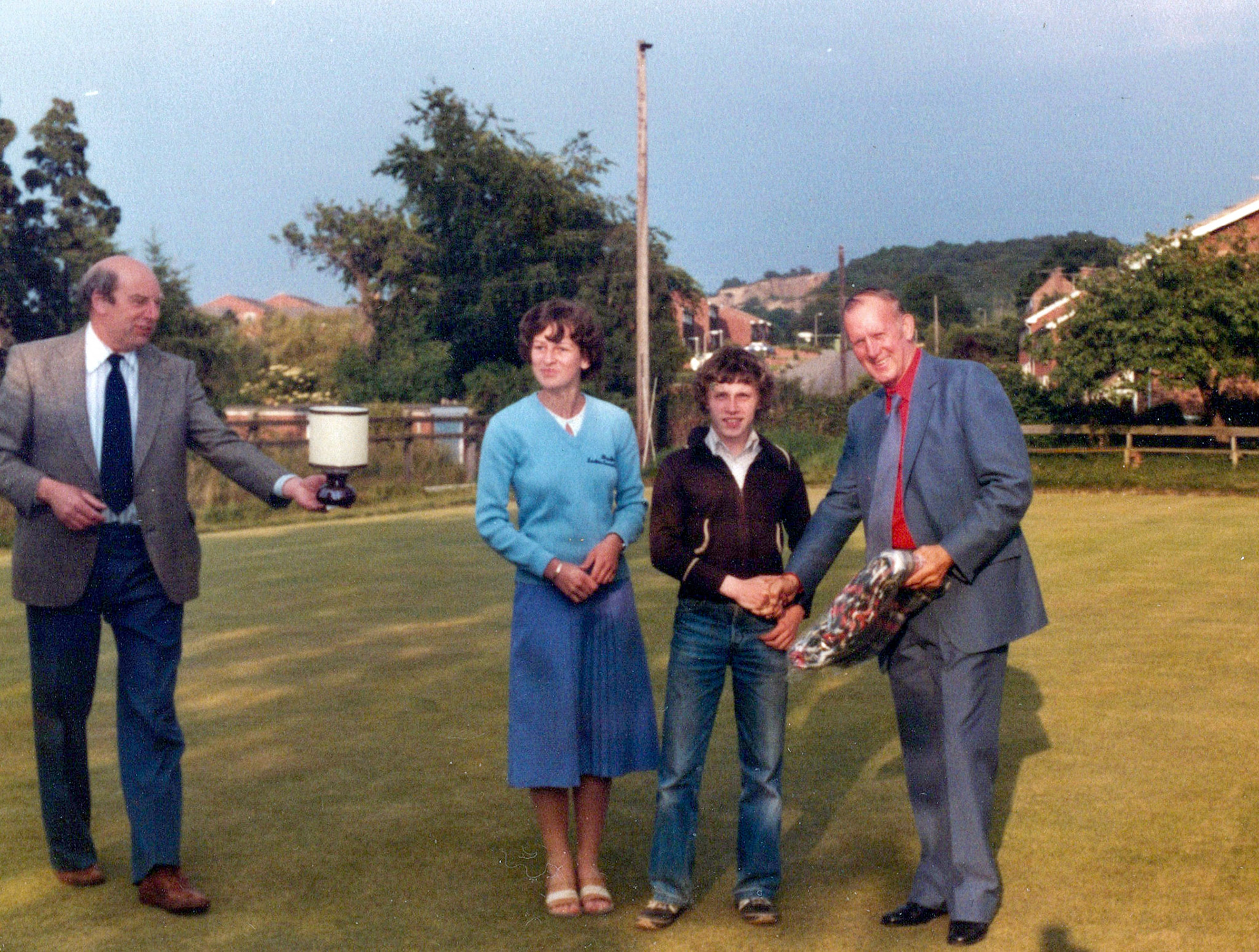 1980's Minsterley Bowling Club. Rosemary Swain identifies Paul Jones being presented with a trophy. Phoebe Spragg recognises Jessie Rowson on the left. (Courtesy Joe Lyons)