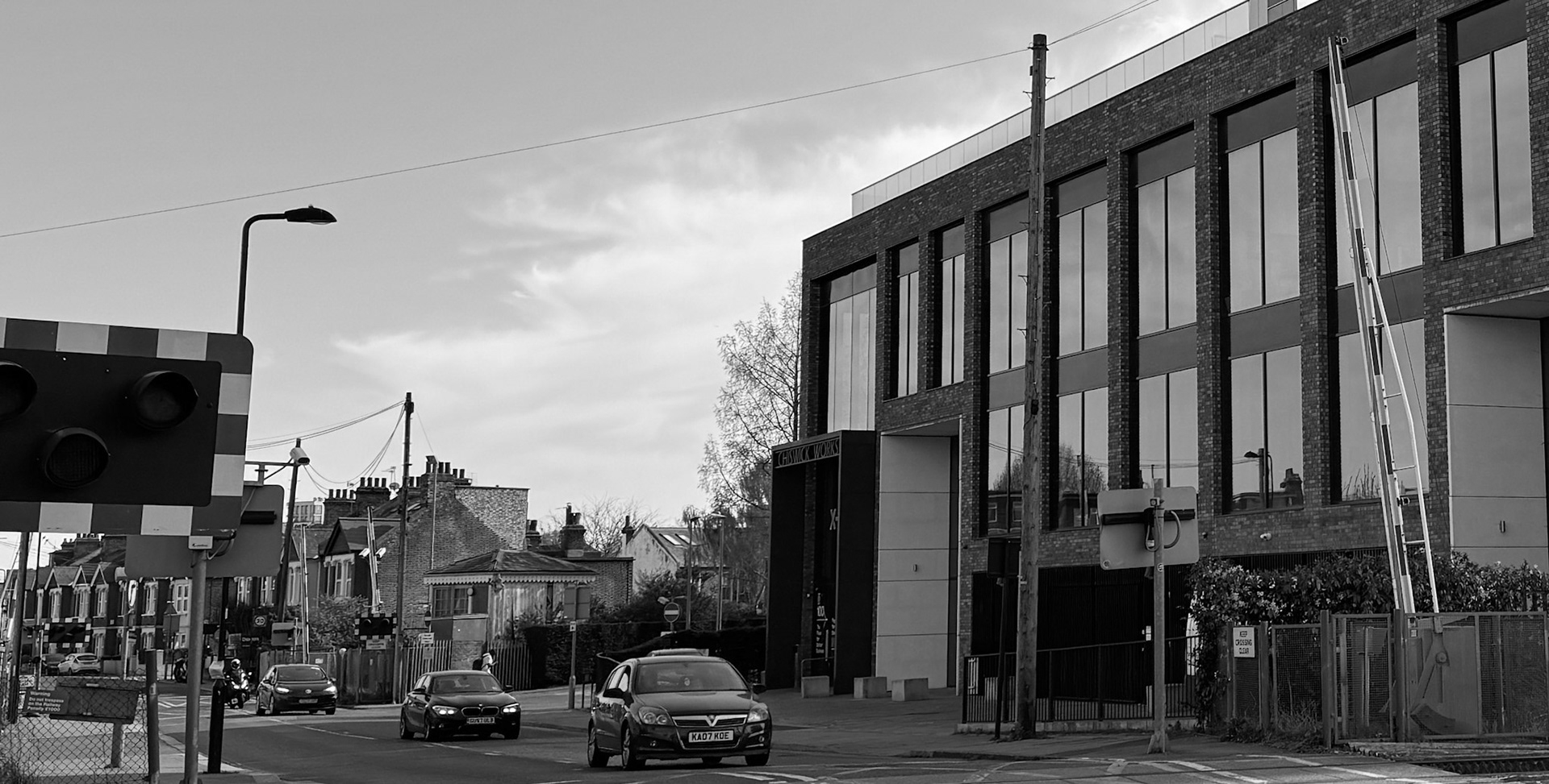 2025 Similar view showing signal box, level crossing and new office building. Express Dairy Tales photo