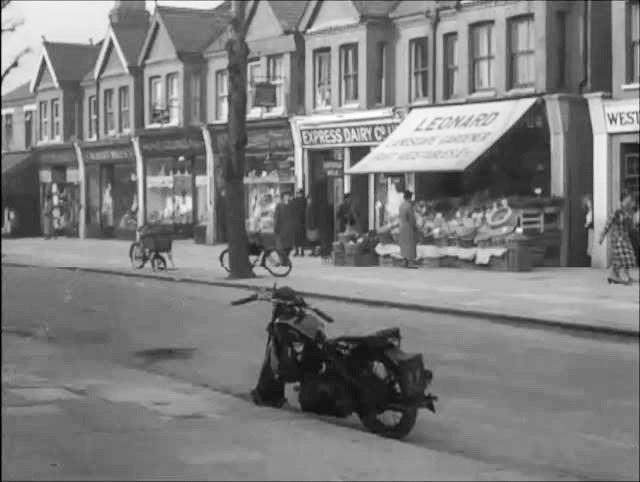 1937 Express shop on Pitshanger Lane, Ealing (between Barnfield and Selby Roads). Still from movie, ‘Feather Your Nest’ https://www.thecinetourist.net/early-ealing.html. (Courtesy Zoe Lyons, Ealing History FB Group)