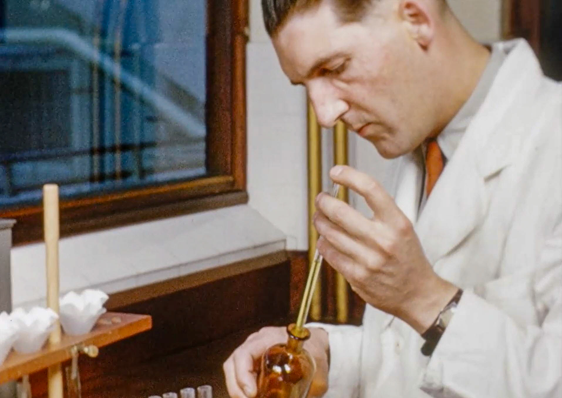 1954 South Morden Laboratory. Might be Sam Jones, who later became overall head of all London laboratories? (Stills from Express Dairy Film)