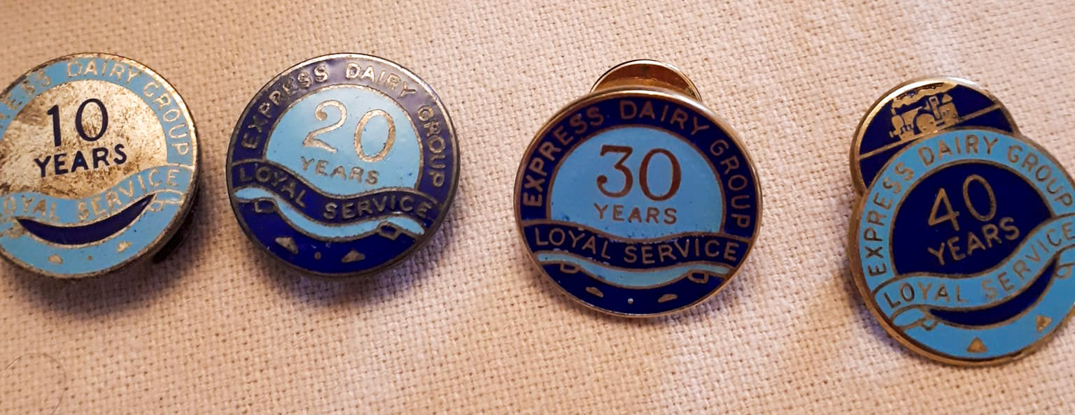 1991 Sid Marie, milkman at Northwood Depot retired after 50 years. Christine Kempster, his daughter, comments "Dad's long service awards-the red tie was 45 years I think. I spent many hours as a child polishing the silver cigarette box! I have all his long service awards...badges and ties with the little train motif, a silver cigarette box and my brother has a watch."