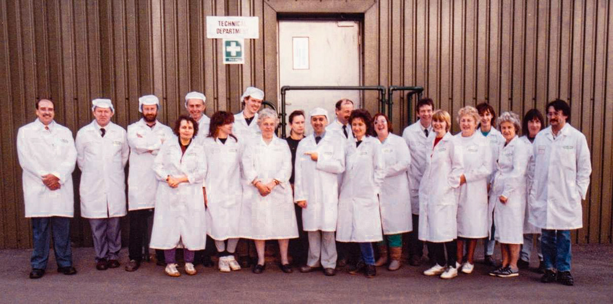 1990's Staplemead. Frank Dineen comments "In front of the "new" technical/lab building when Maggie Goulter retired." Charles Daniel also comments (helped by others) "A bit of a memory test....from left to right: Mike Sheppard, Steve Crutchley, Graham Perrett, Leonie Good, Mike Swift, Nadja Byrne, Andy Heys, Maggie Goulter, Julie Middleton, Frank Dineen, Jeff Bynoth, Cherry Blumberg, Janet Millard, Arthur Priddle, Wendy Lucas-Phillips, Penny Bradley, Jenny Ford, Josie Cusman, Christine Perrett, Terry Atkinson. A great team!" (Courtesy Frank Dineen)