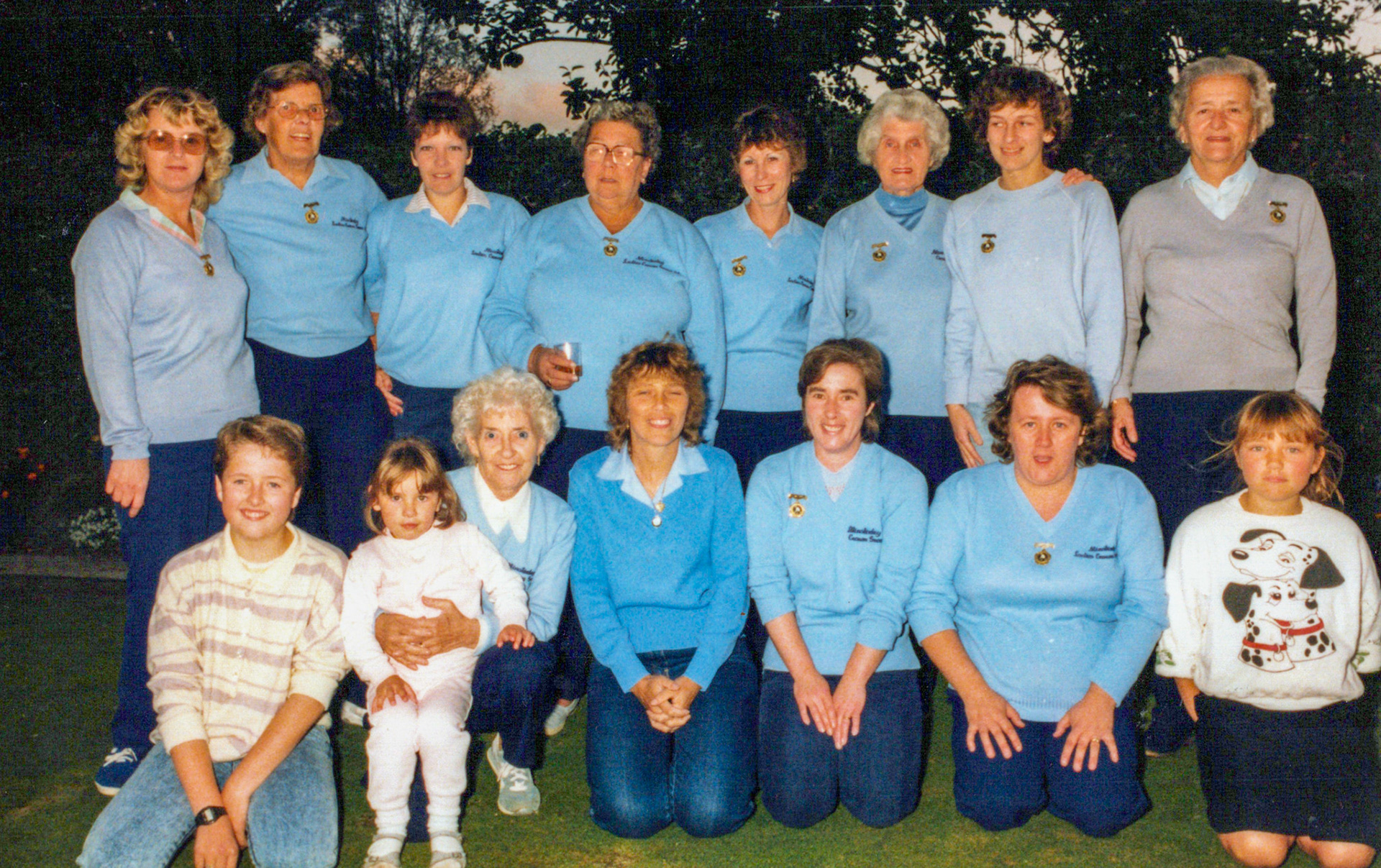 1986 Minsterley Sports Team. Val Bromley identifies Gerda Lyons, Janice Haycock, Mary Roberts, Caroline Jones, Rose ?, Jane Roberts, Ada Lloyd, Sarah Wortley, ? Mrs Allen, Sylvia Povey, Val Bromley, Lorraine Ingram, Sharon Hamer (nee Povey). Liz Matthews comments "The very small one is Beckie Can, Jane Hoofe's daughter." (Courtesy Joe Lyons)