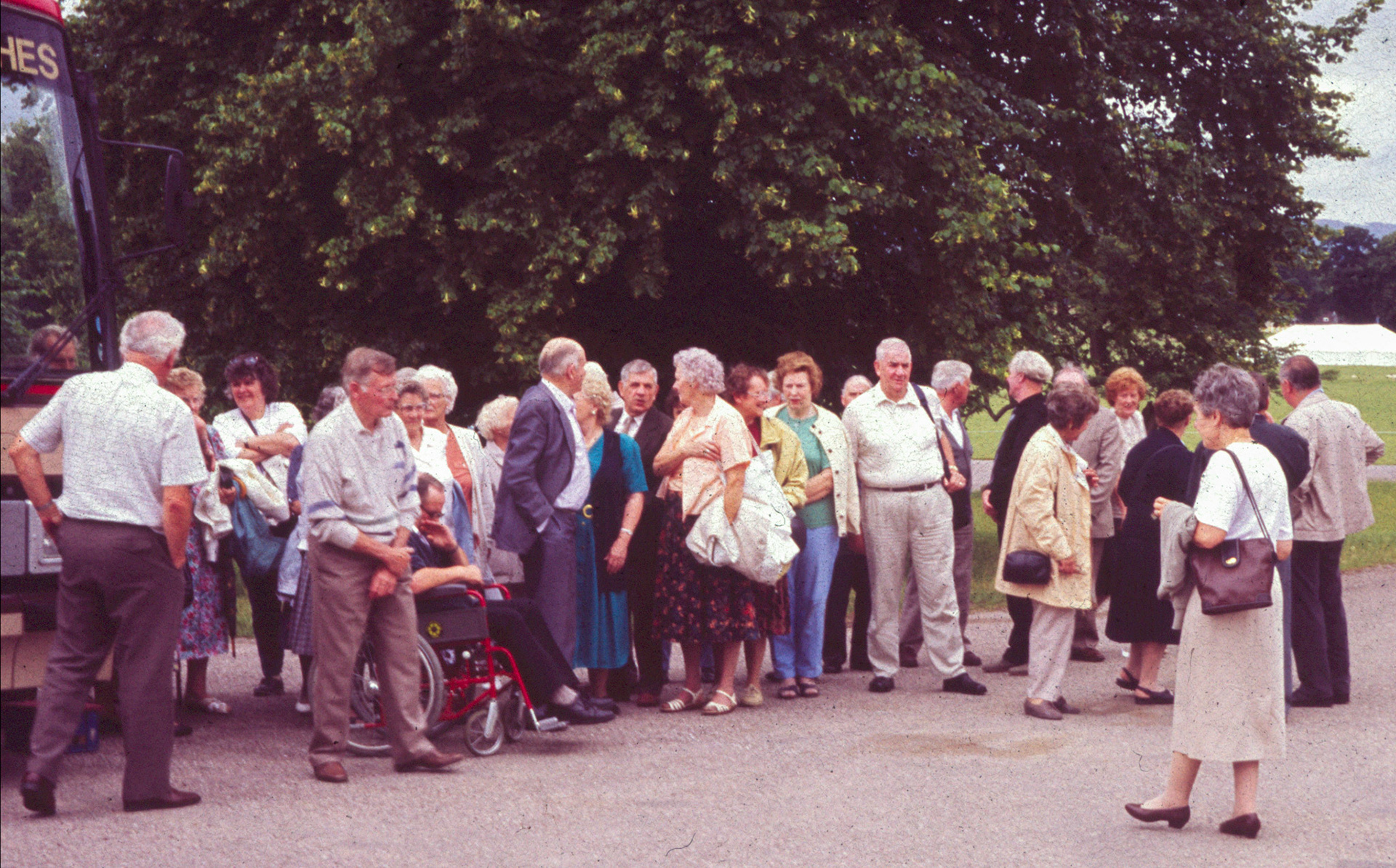 1995 Social Club Outing to Kinton. Chris Evans comments "My mother in the middle with coats and jackets under her arm-Mary Evans. Never travelled light. Think it's my uncle Don Davies talking to her in the black suit." (Joe Lyons 35mm slides)