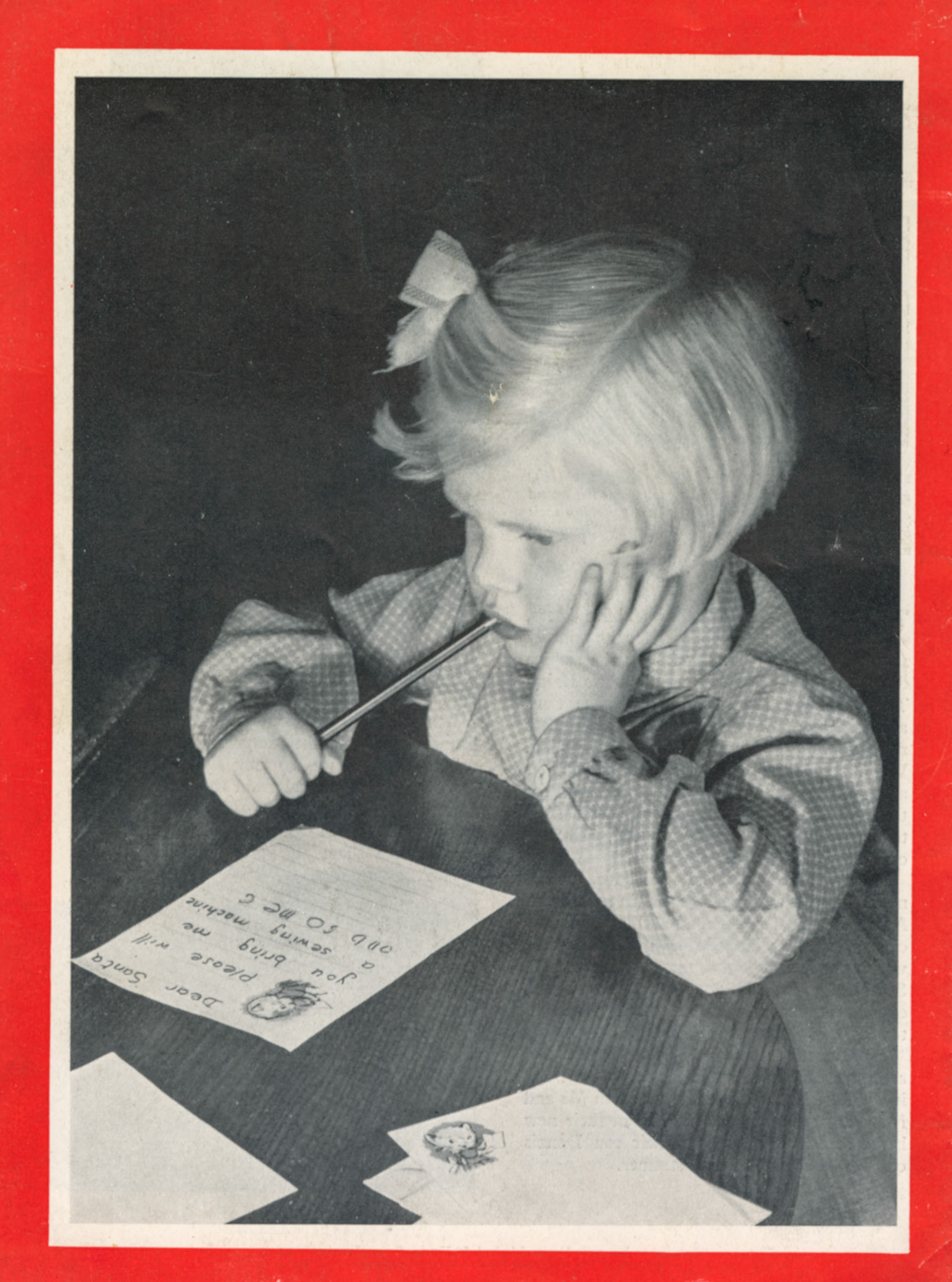 Photo from Mr I.L. Kirton 'A young customer composes a throughtful request for bigger and better presents'