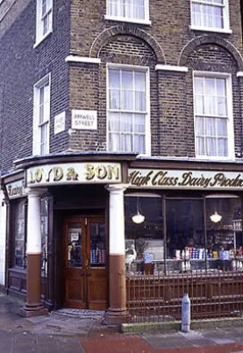 1980's? View of 42 Amwell Street from the north-west, showing the corner entrance and double shopfront of the former Lloyd's Dairy with its gold painted lettering on glass.