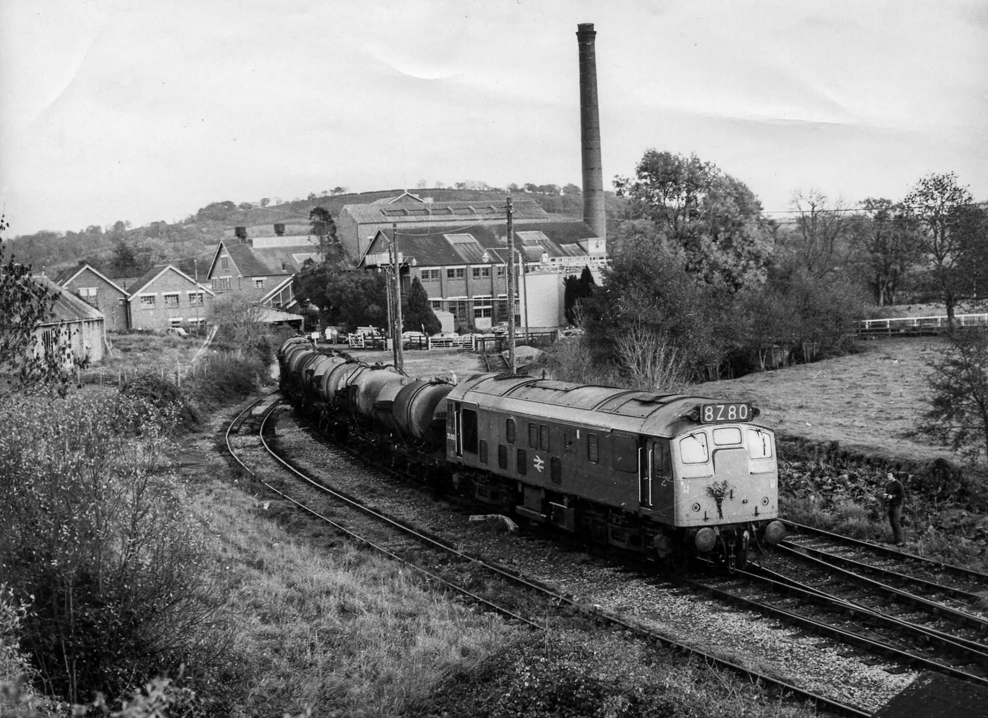 1970s? Hemyock, Devon-"A diesel locomotive with a rake of milk tanks, after the station had closed." Amyas Crump comments "That’s after it had been demolished, quite possibly the last train." Express only did egg packing at Hemyock, the dairy later became St Ivel. (Courtesy Discovering Devon, Somerset and beyond FB)