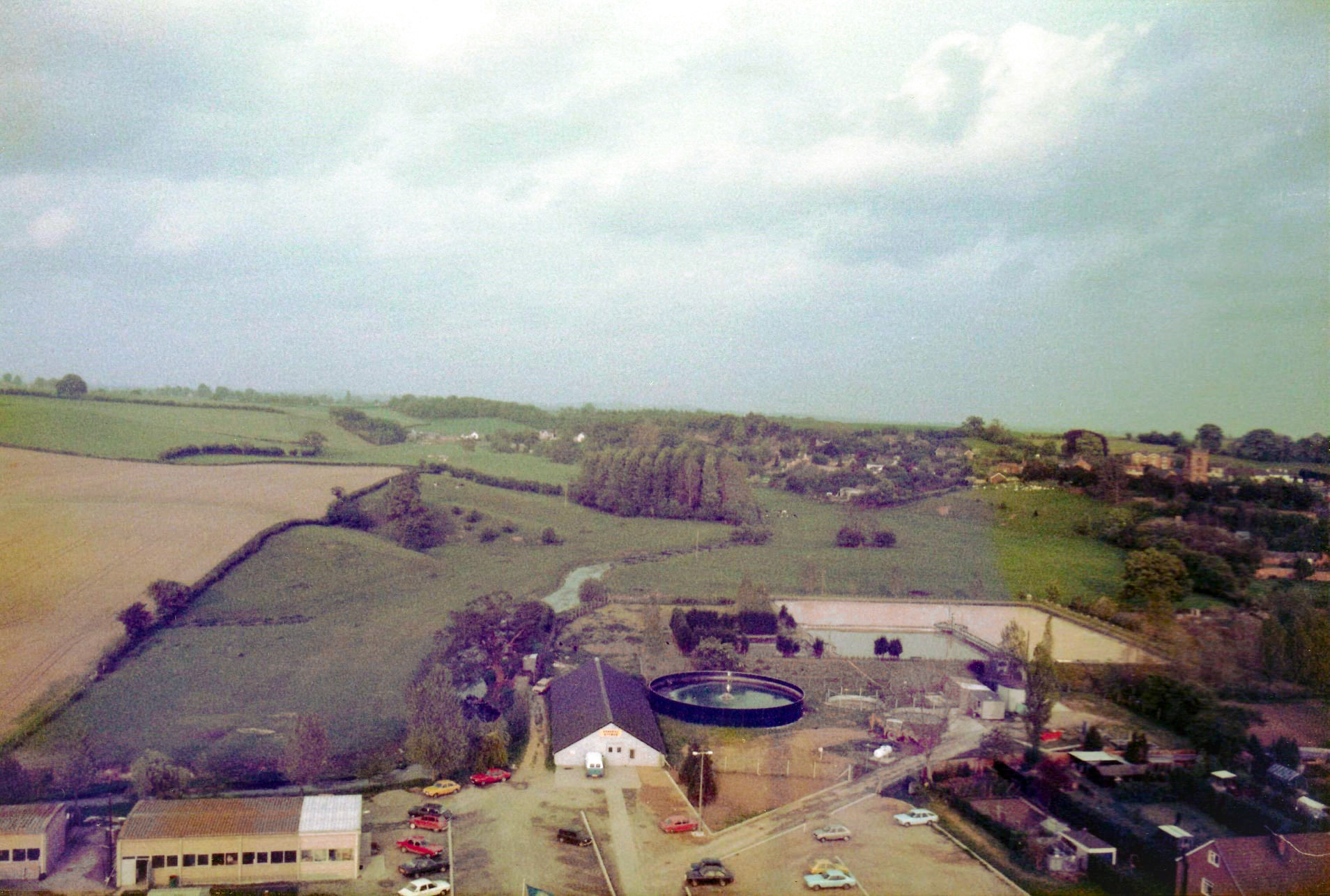 1986 Ruyton. Stephen Graves comments "I climbed inside the newly erected chimney before it was in service and took some panoramic shots from the top. The last picture shows a handrail upright-I'm sure that would have stopped me falling off! The pictures are overlooking the Cheese and Press Rooms and include the Builders Shop, Engineering Workshop, Stores and Effluent Plant. I worked in the Engineering department at the site from 1982-1993 when it closed. Great Times and Great People." (Courtesy Stephen Graves, Ruyton Revisited FB Group)